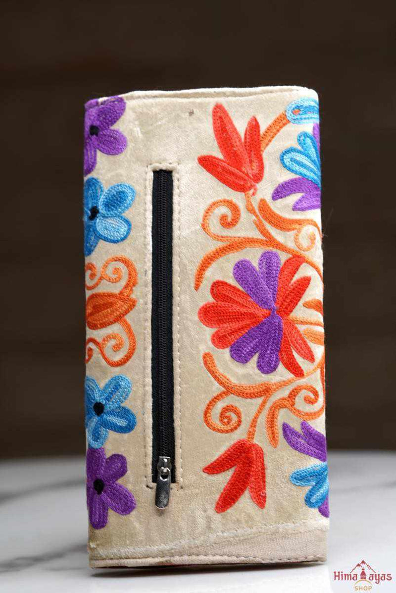 A lightweight everyday wallet, perfect size for your essentials, crafted from beautiful hand-embroidery design on a suede leather.