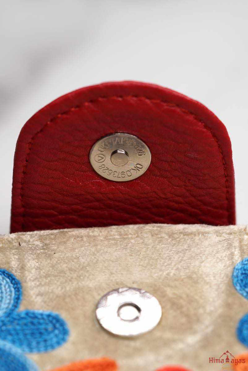 A lightweight everyday wallet, perfect size for your essentials, crafted from beautiful hand-embroidery design on a suede leather.