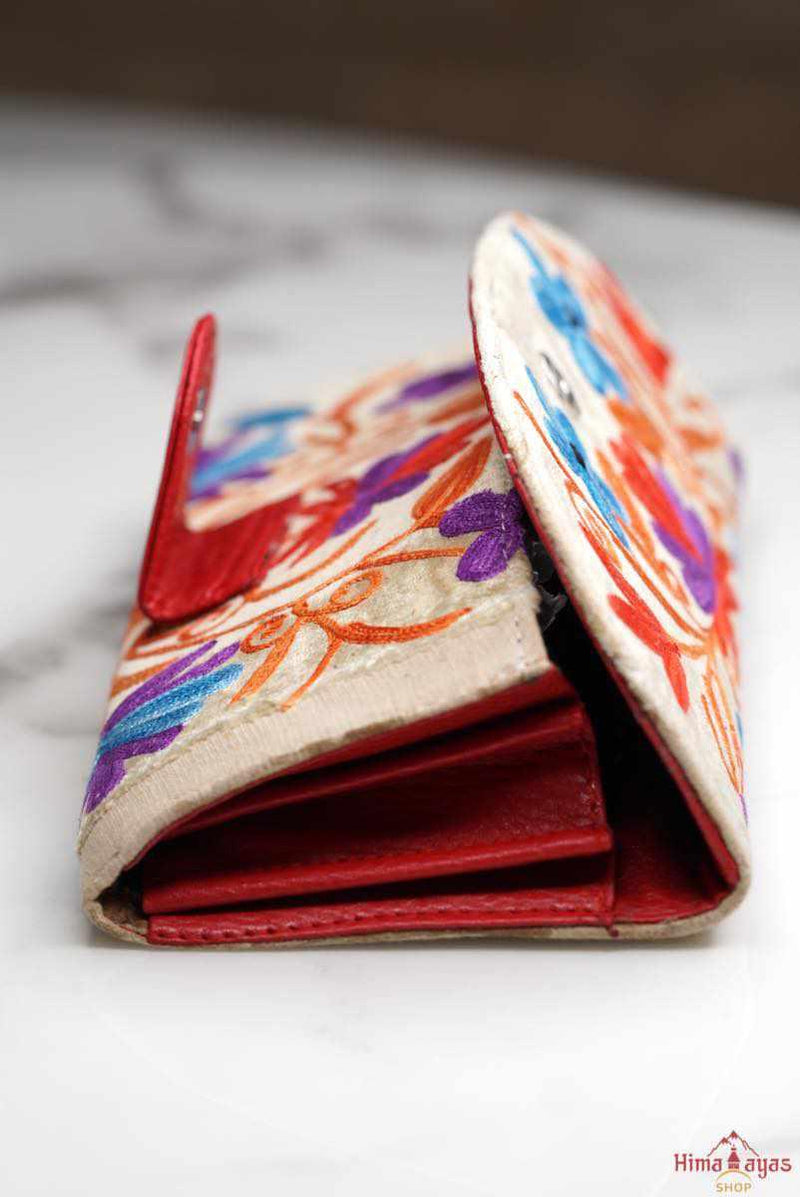 A lightweight everyday wallet, perfect size for your essentials, crafted from beautiful hand-embroidery design on a suede leather.
