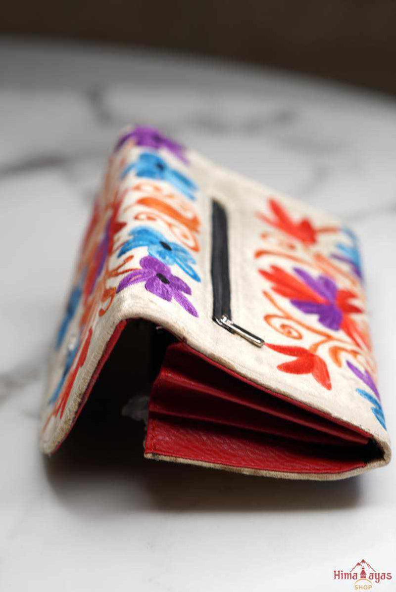 A lightweight everyday wallet, perfect size for your essentials, crafted from beautiful hand-embroidery design on a suede leather.