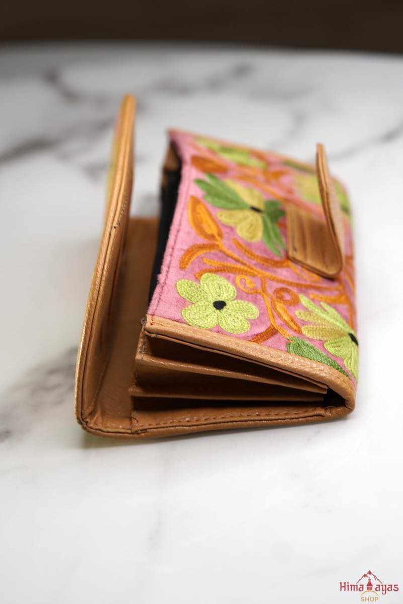 A lightweight everyday wallet, perfect size for your essentials, crafted from beautiful hand-embroidery design on a suede leather.