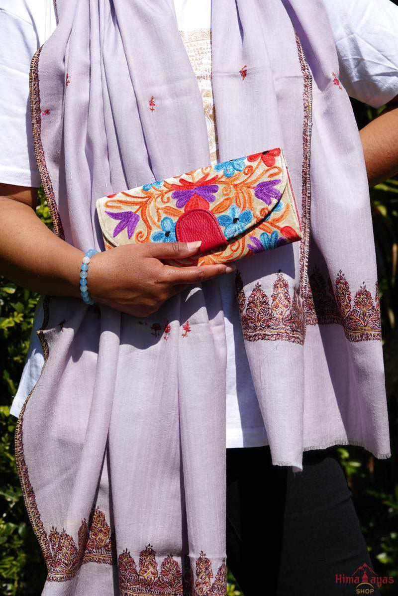 This stunning piece of handcrafted wallet is specially designed with Kashmiri style hand-embroidery. Perfect for everyday use, you can organize your money and cards perfectly in this wallet.