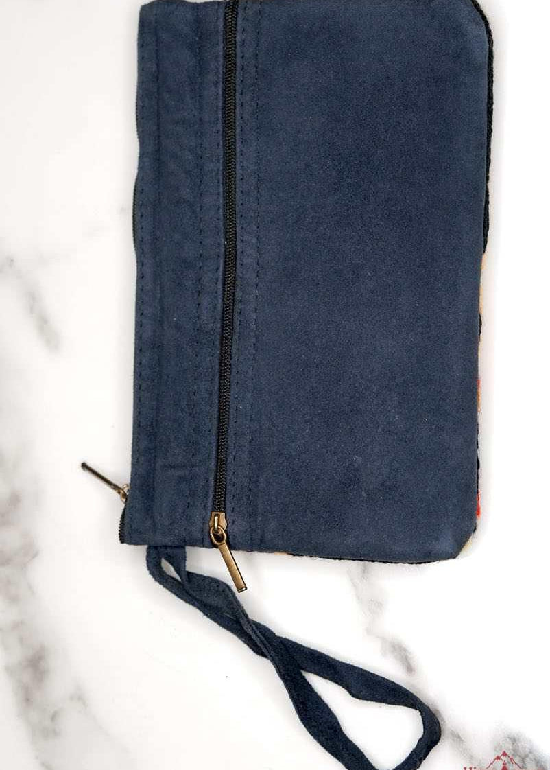 A stylish yet convenient hand woven wristlet purse with beautiful floral pattern, It has a secure zip top closure and two extra compartments for your everyday essentials making it easy to travel simple and light.