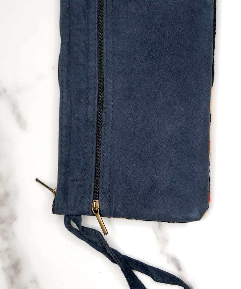 A stylish yet convenient hand woven wristlet purse with beautiful floral pattern, It has a secure zip top closure and two extra compartments for your everyday essentials making it easy to travel simple and light.