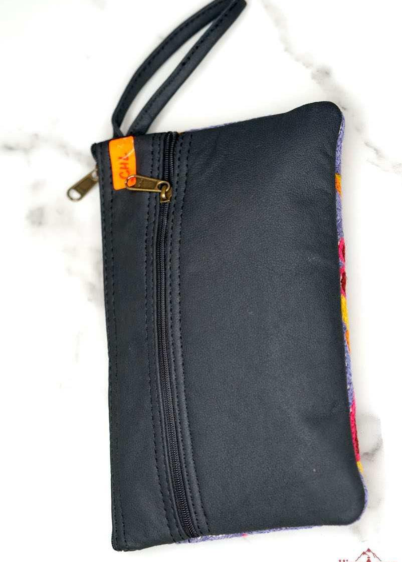 Beautiful flower pattern woman's purse that features a wristlet and secure zip top closure.