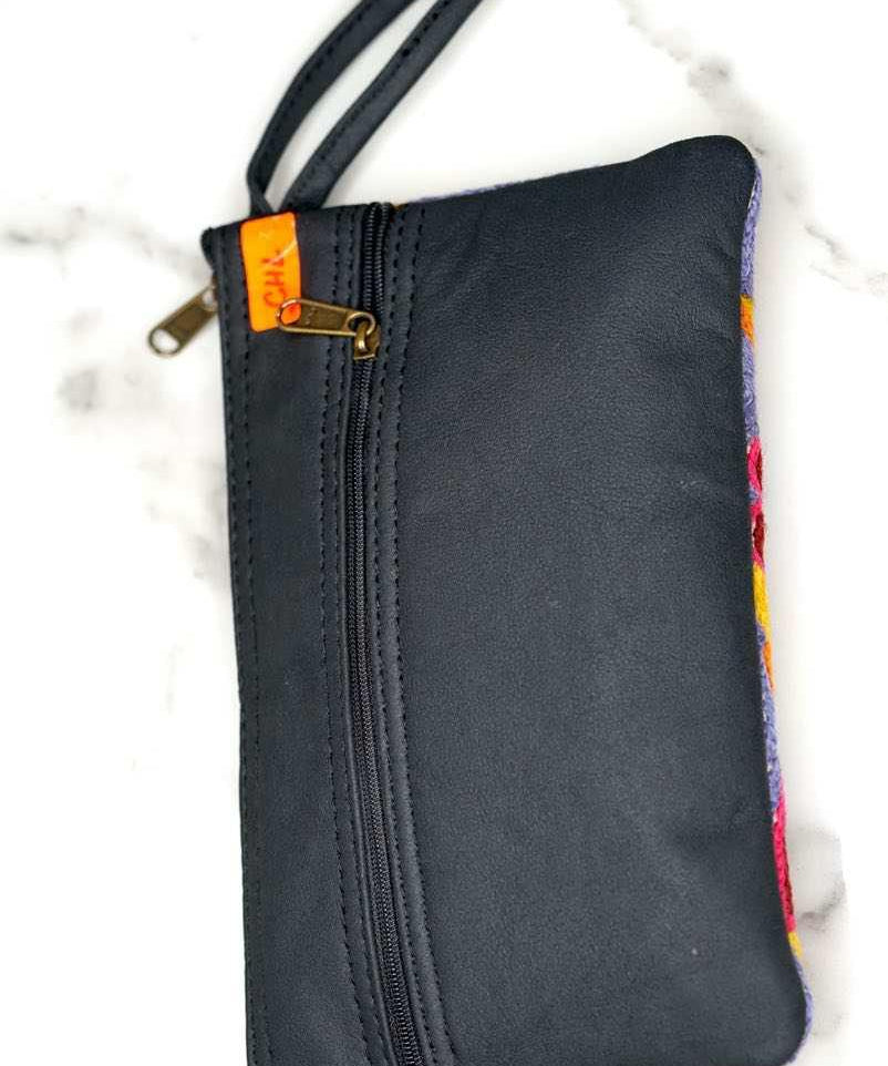 Beautiful flower pattern woman's purse that features a wristlet and secure zip top closure.