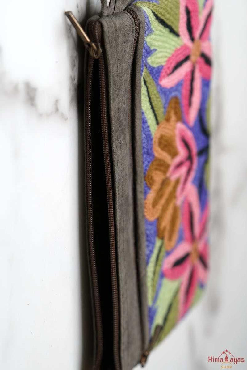 A stylish yet convenient hand woven wristlet purse with beautiful floral pattern, It has a secure zip top closure and two extra compartments for your everyday essentials making it easy to travel simple and light.