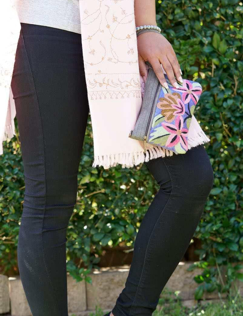 A stylish yet convenient hand woven wristlet purse with beautiful floral pattern, It has a secure zip top closure and two extra compartments for your everyday essentials making it easy to travel simple and light.