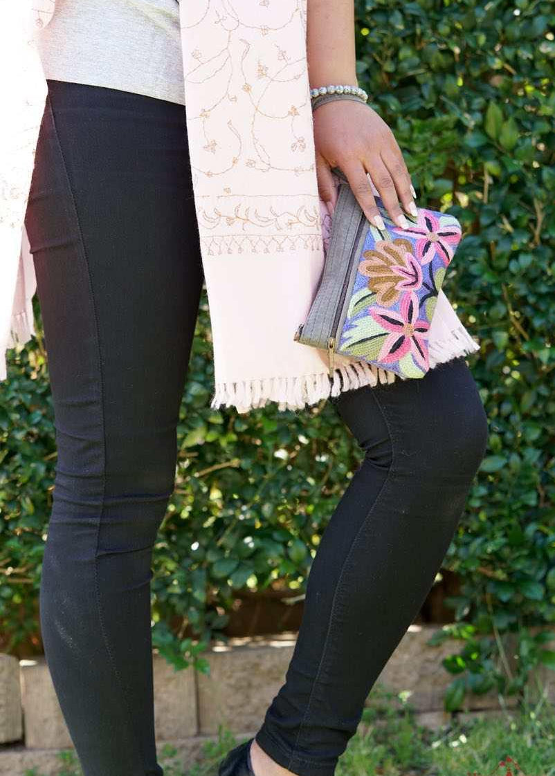 A stylish yet convenient hand woven wristlet purse with beautiful floral pattern, It has a secure zip top closure and two extra compartments for your everyday essentials making it easy to travel simple and light.