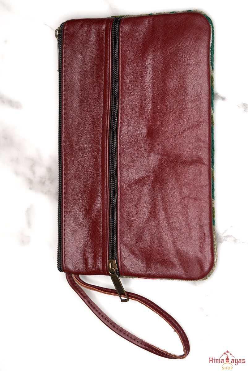  The wallet is crafted with top quality hand-woven fabric, with PU leather at the back. It features a wristlet and a secure zip top closure , two extra compartments both at front and back to carry all your everyday use essentials.