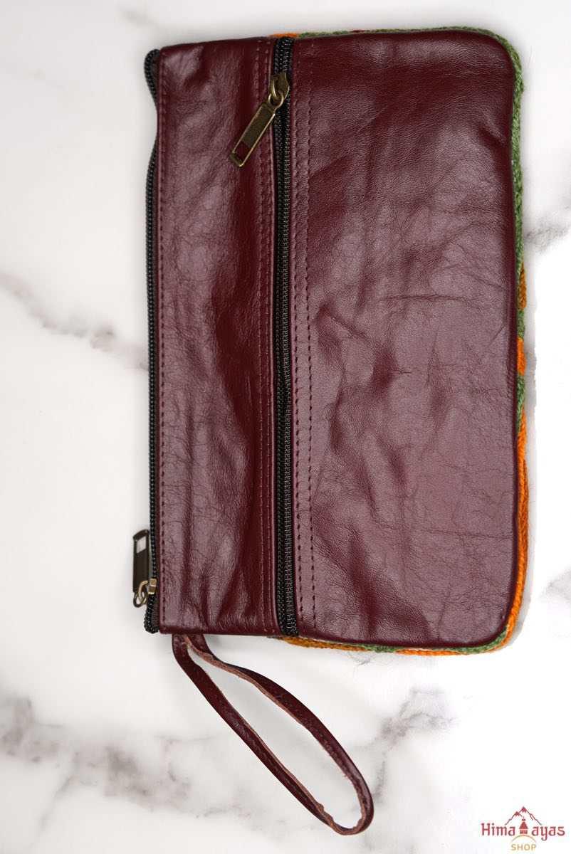  The wallet is crafted with top quality hand-woven fabric, with PU leather at the back. It features a wristlet and a secure zip top closure , two extra compartments both at front and back to carry all your everyday use essentials.