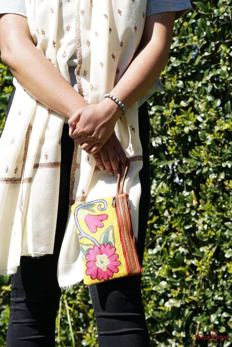 A stylish floral design women's purse, crafted with top quality hand-woven fabric, with PU leather at the back.