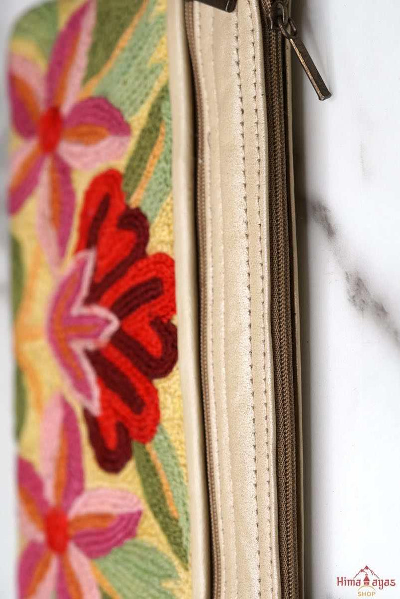 A stylish yet convenient hand woven wristlet purse with beautiful floral pattern, It has a secure zip top closure and two extra compartments for your everyday essentials making it easy to travel simple and light.