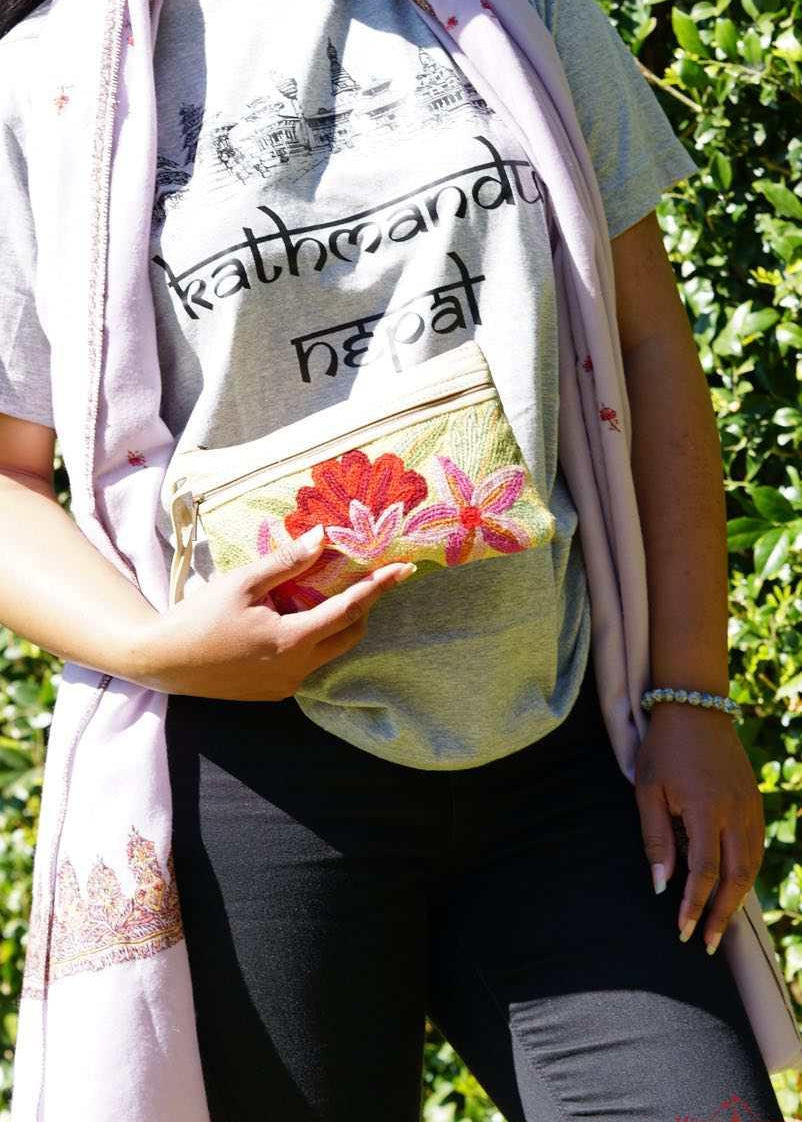 A stylish yet convenient hand woven wristlet purse with beautiful floral pattern, It has a secure zip top closure and two extra compartments for your everyday essentials making it easy to travel simple and light.