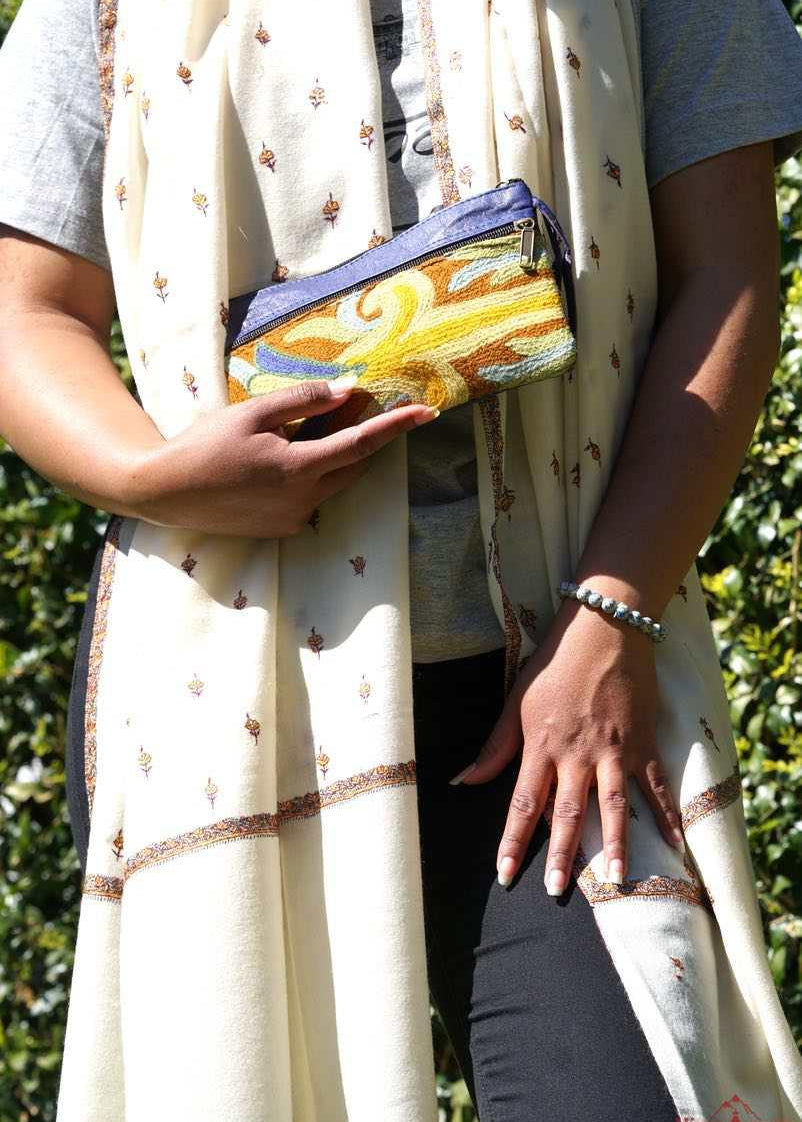 A stylish and ethically made wristlet purse to carry all your everyday essentials. 