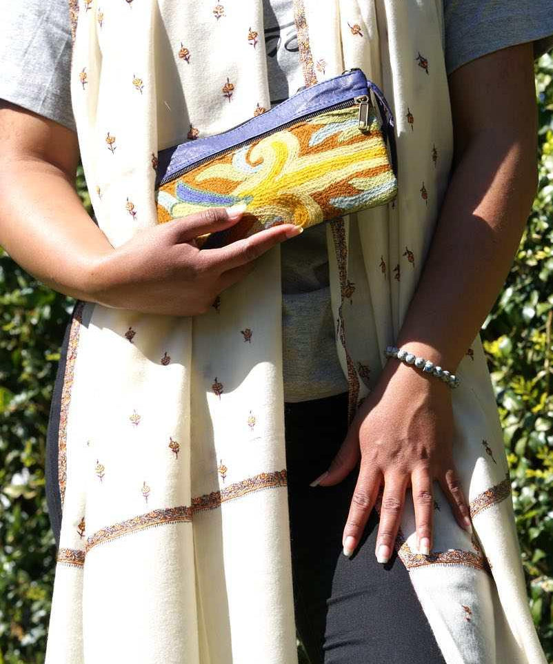 A stylish and ethically made wristlet purse to carry all your everyday essentials. 