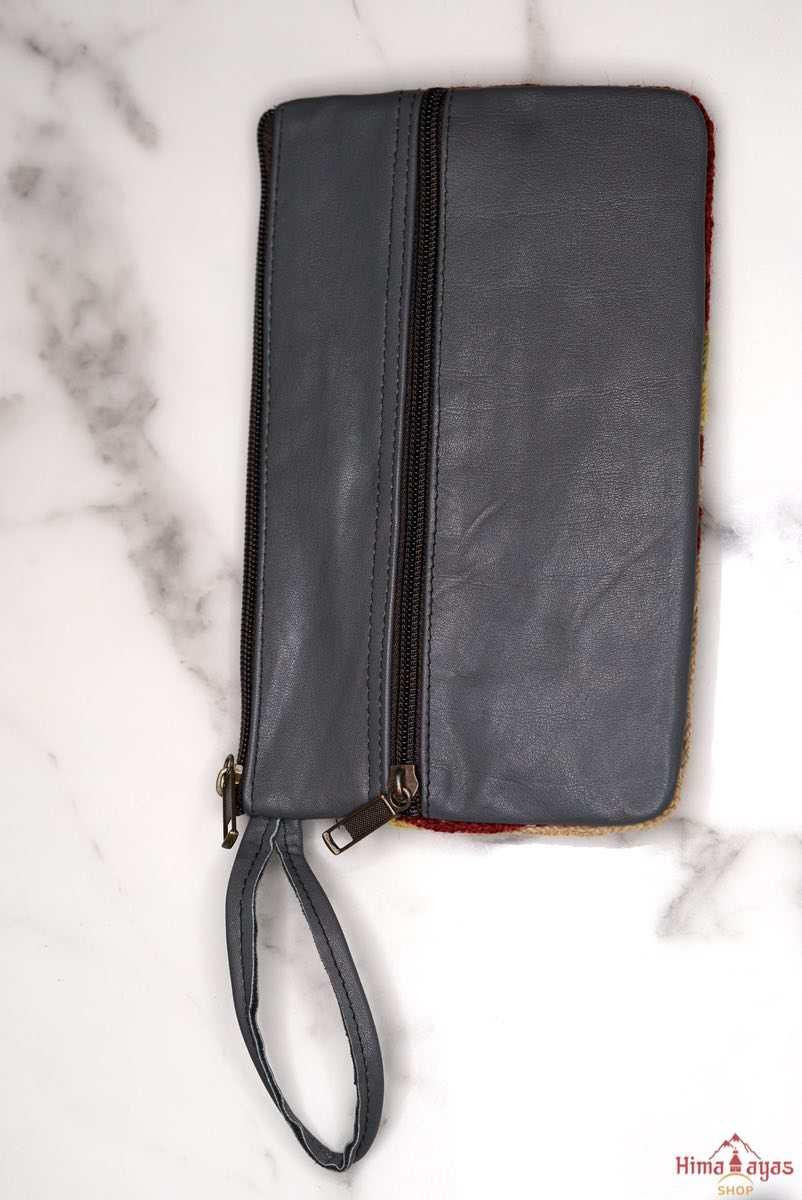  The wallet is crafted with top quality hand-woven fabric, with PU leather at the back. It features a wristlet and a secure zip top closure , two extra compartments both at front and back to carry all your everyday use essentials.