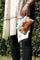 A stylish yet convenient hand woven wristlet purse with beautiful floral pattern, It has a secure zip top closure and two extra compartments for your everyday essentials making it easy to travel simple and light.
