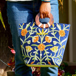 A classic women's tote bag, crafted with beautiful cashmere floral embroidery to give it a chic stylish look.