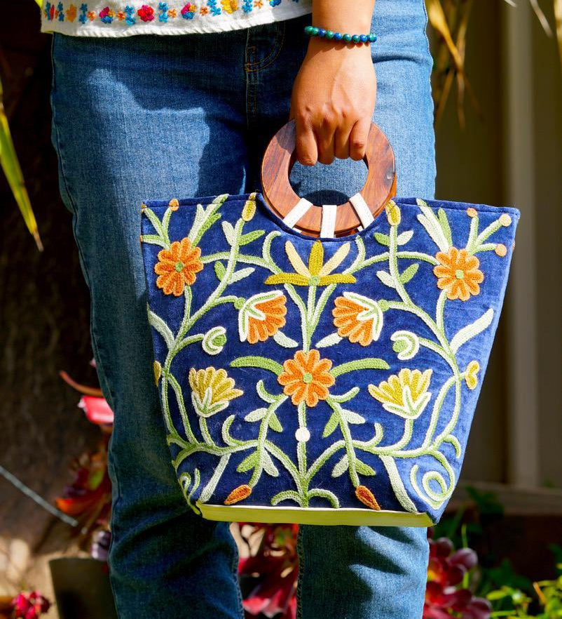 A classic women's tote bag, crafted with beautiful cashmere floral embroidery to give it a chic stylish look.