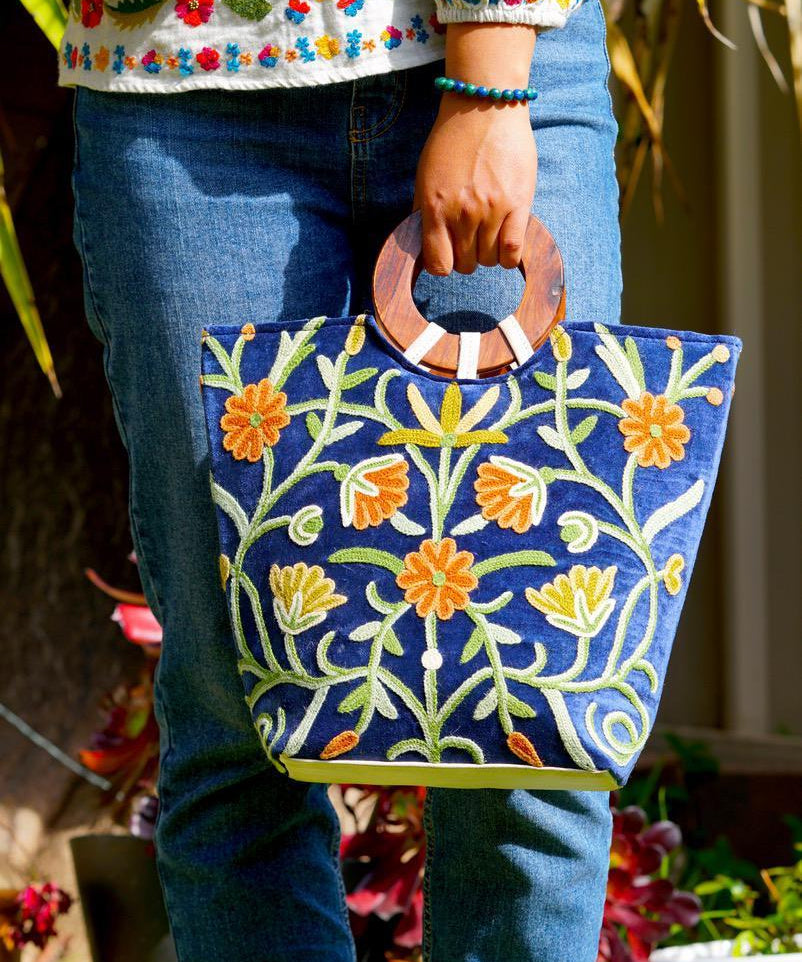A classic women's tote bag, crafted with beautiful cashmere floral embroidery to give it a chic stylish look.