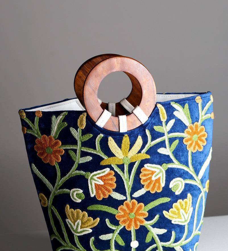 A classic women's tote bag, crafted with beautiful cashmere floral embroidery to give it a chic stylish look.