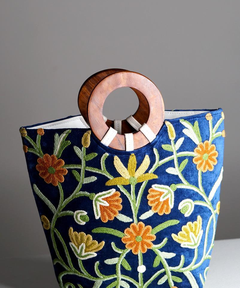 A classic women's tote bag, crafted with beautiful cashmere floral embroidery to give it a chic stylish look.