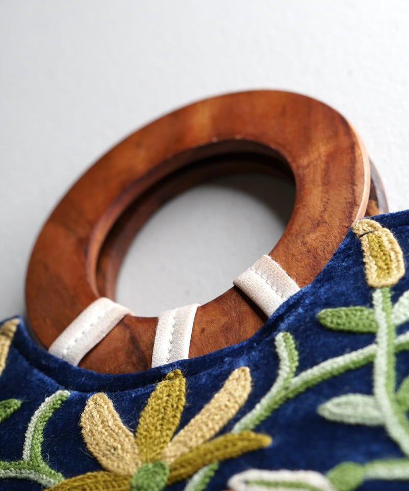 A classic women's tote bag, crafted with beautiful cashmere floral embroidery to give it a chic stylish look.