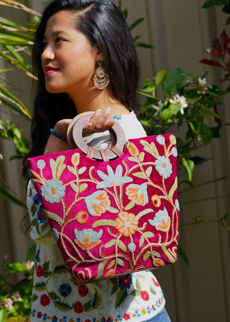 A classic women's tote bag, crafted with beautiful cashmere floral embroidery to give it a chic stylish look.