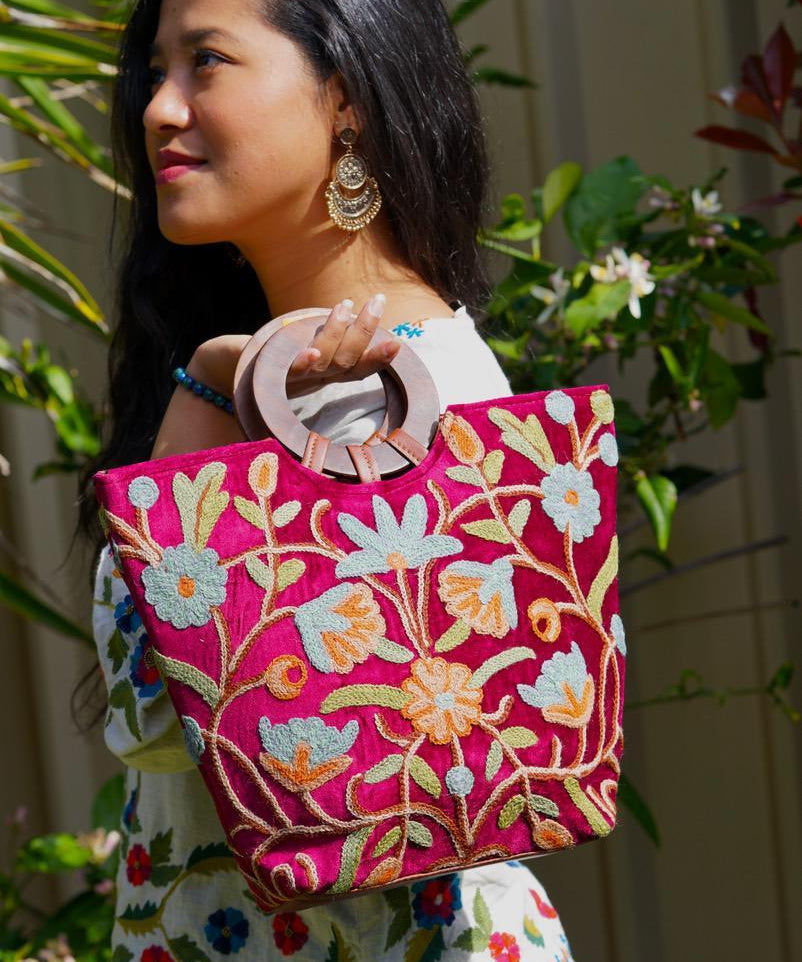 A classic women's tote bag, crafted with beautiful cashmere floral embroidery to give it a chic stylish look.