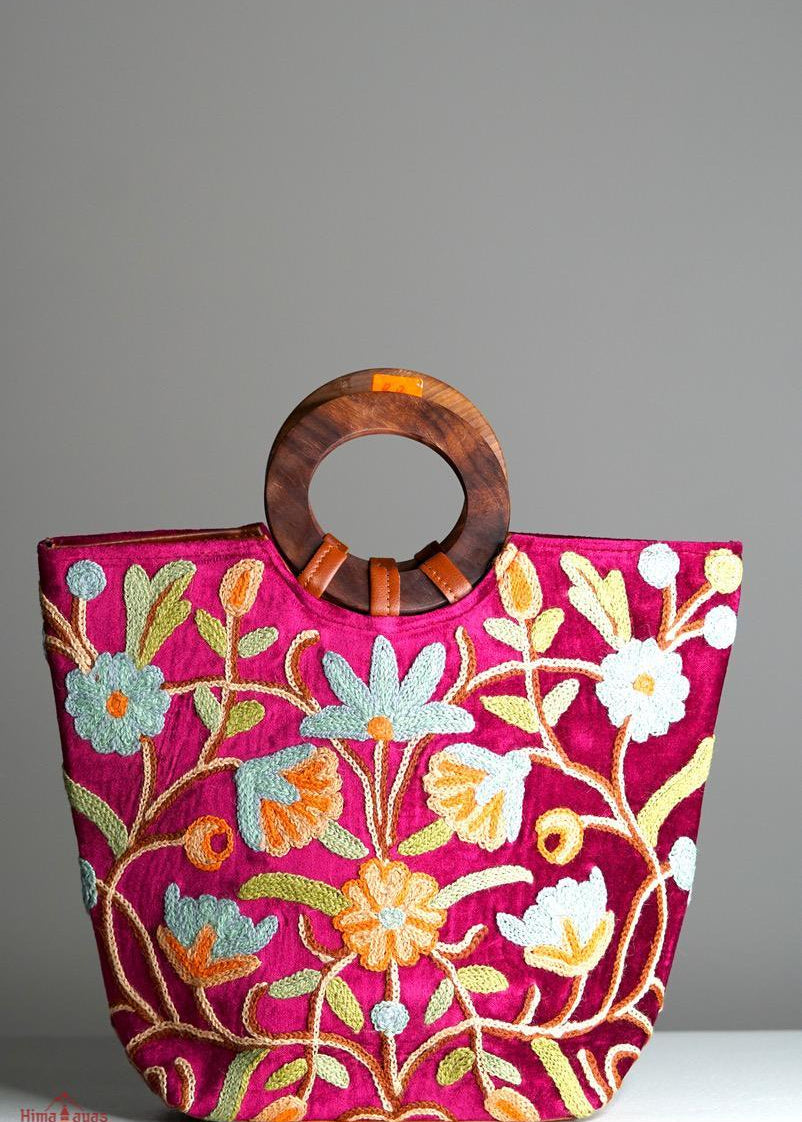 A classic women's tote bag, crafted with beautiful cashmere floral embroidery to give it a chic stylish look.