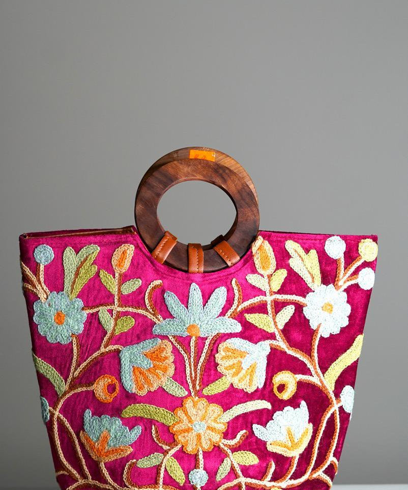 A classic women's tote bag, crafted with beautiful cashmere floral embroidery to give it a chic stylish look.