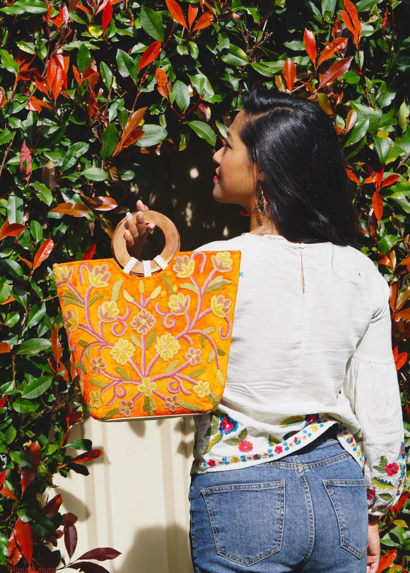 A stylish women's tote bag with floral pattern, crafted ethically from Himalayas.