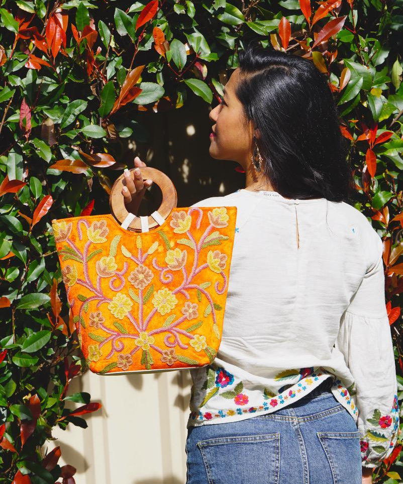 A stylish women's tote bag with floral pattern, crafted ethically from Himalayas.