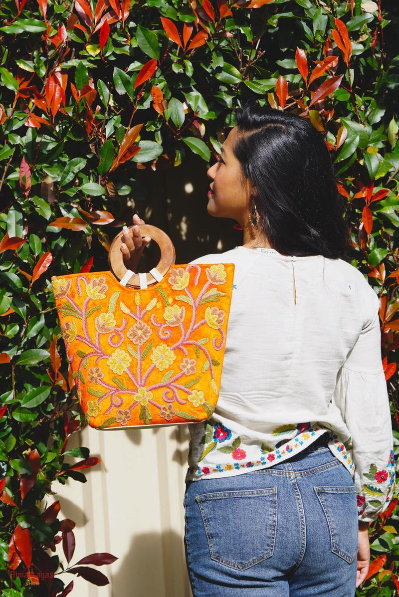 A stylish women's tote bag with floral pattern, crafted ethically from Himalayas.
