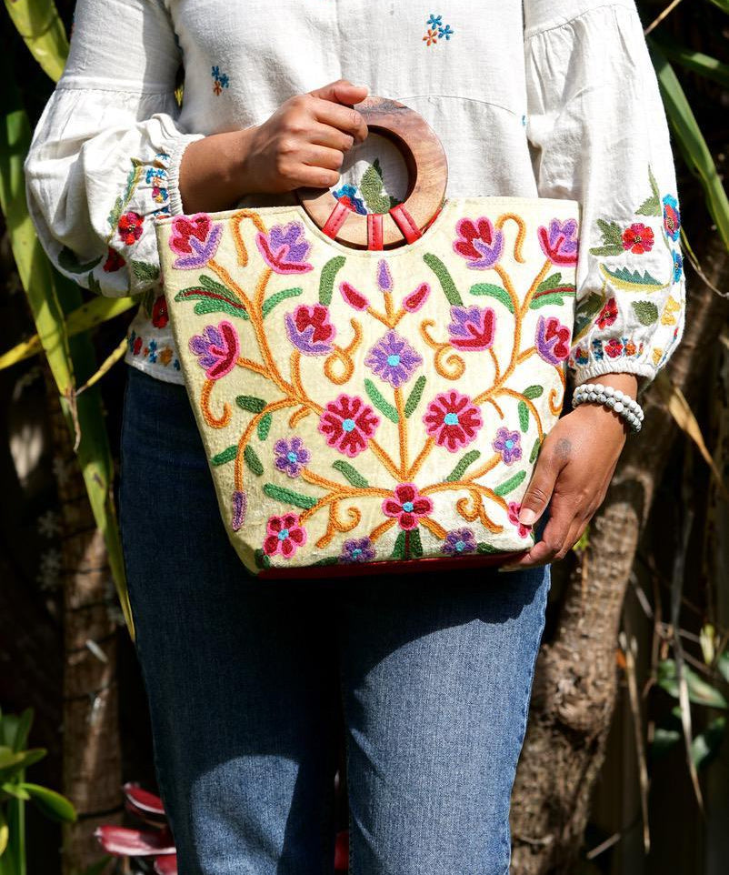 A stylish women's tote bag with floral pattern, crafted ethically from Himalayas.