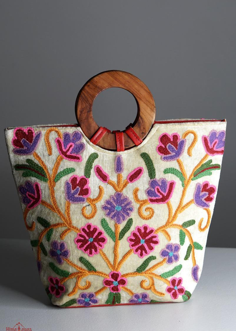 A stylish women's tote bag with floral pattern, crafted ethically from Himalayas.