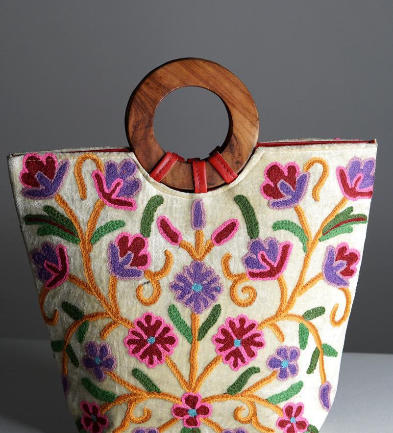 A stylish women's tote bag with floral pattern, crafted ethically from Himalayas.