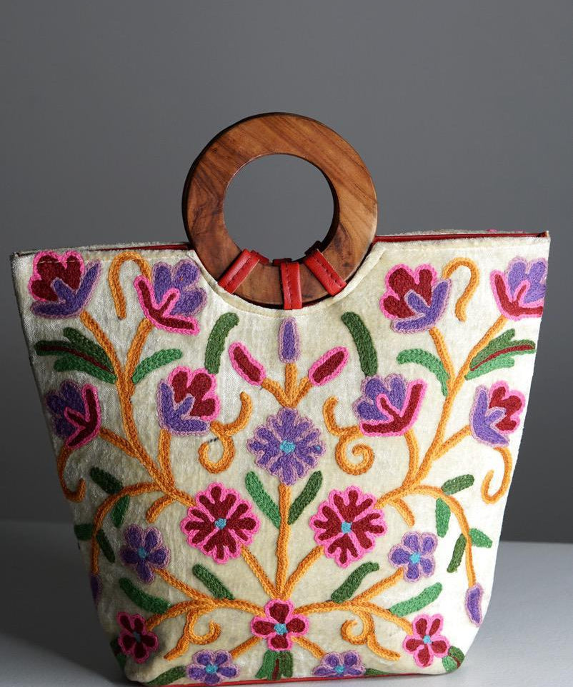 A stylish women's tote bag with floral pattern, crafted ethically from Himalayas.