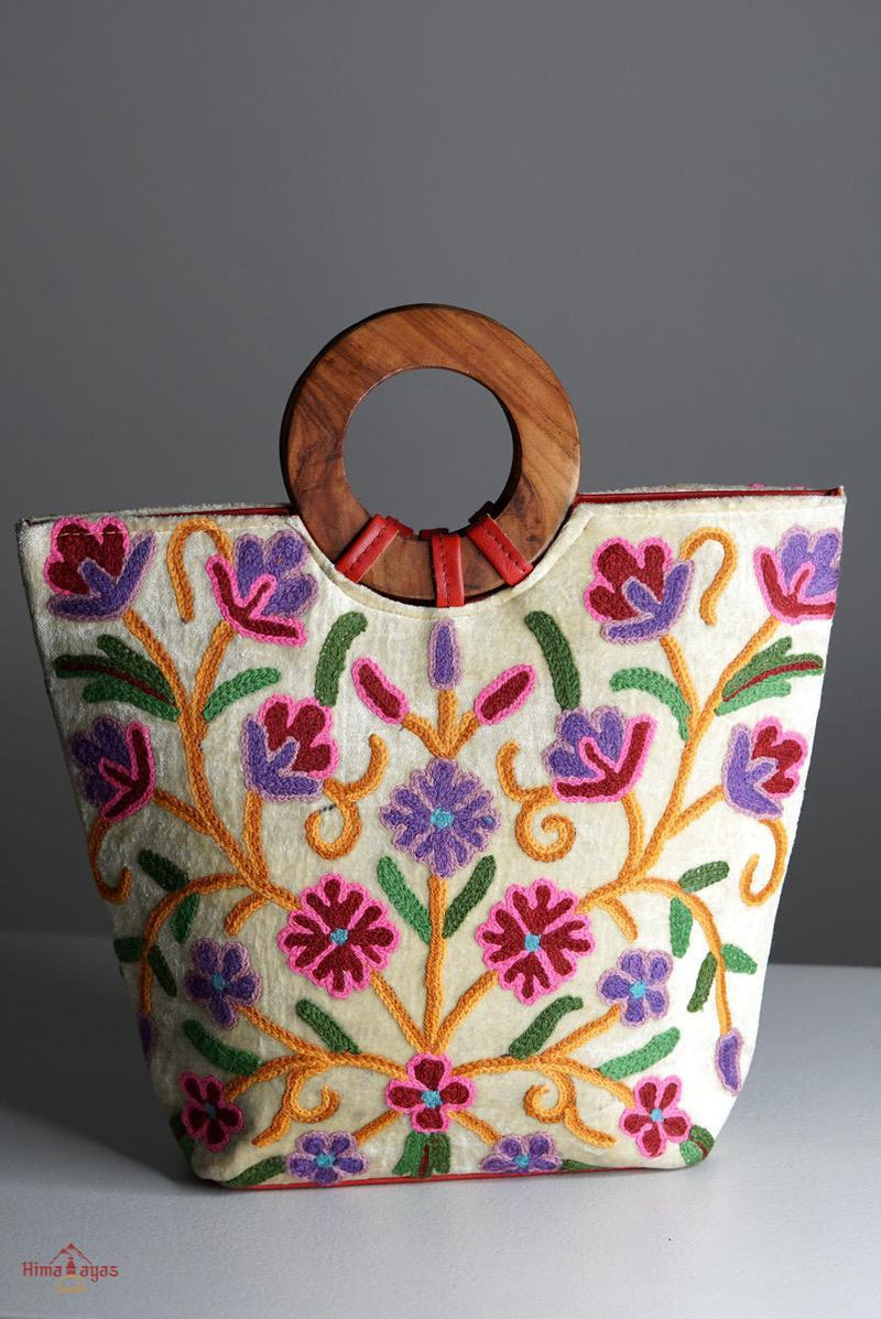 A stylish women's tote bag with floral pattern, crafted ethically from Himalayas.