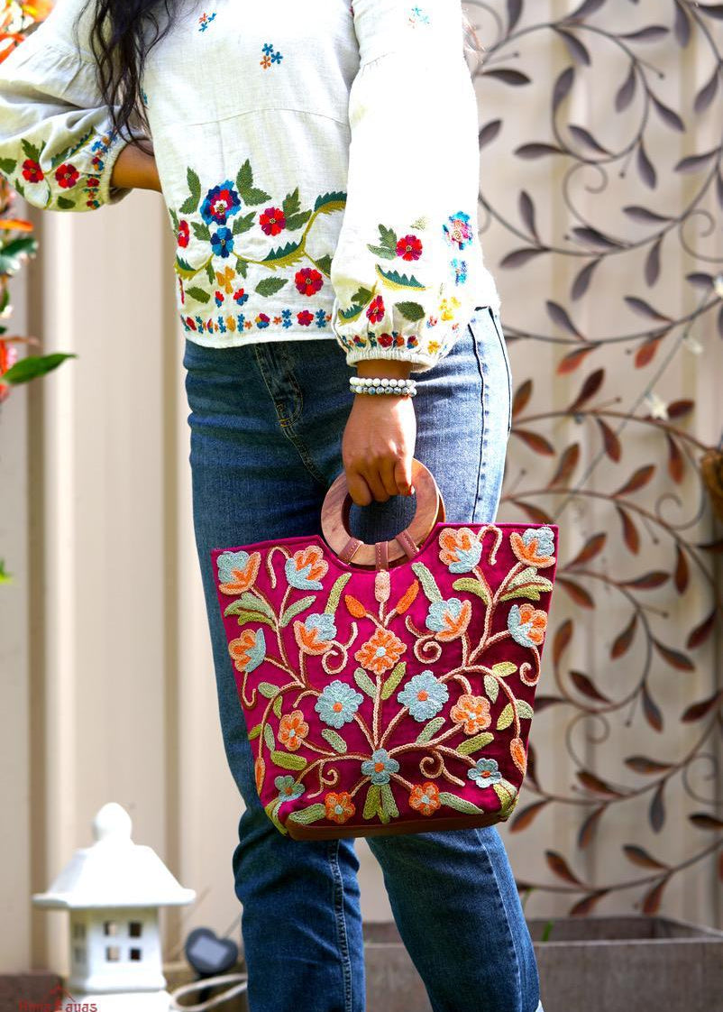 Beautiful hand embroidered tote bag with bright and multi-colour embroidered floral patterns.
