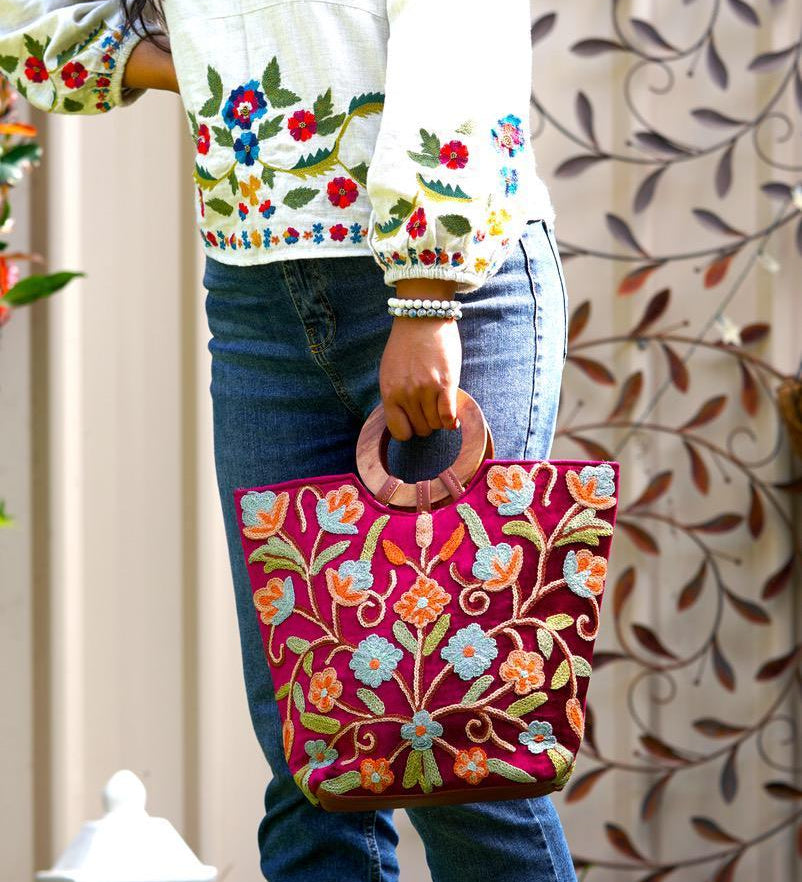 Beautiful hand embroidered tote bag with bright and multi-colour embroidered floral patterns.