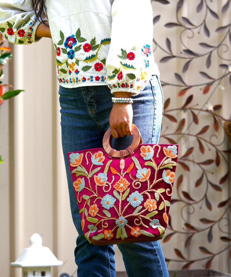 Beautiful hand embroidered tote bag with bright and multi-colour embroidered floral patterns.