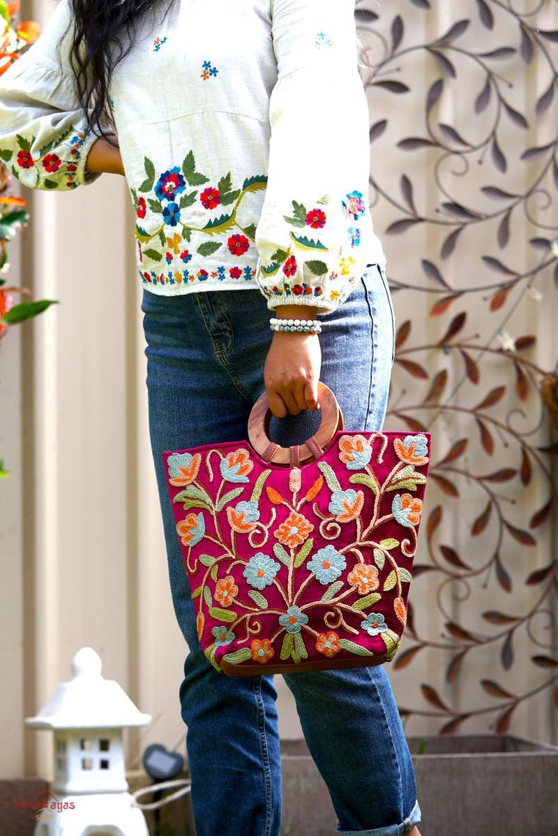 Beautiful hand embroidered tote bag with bright and multi-colour embroidered floral patterns.
