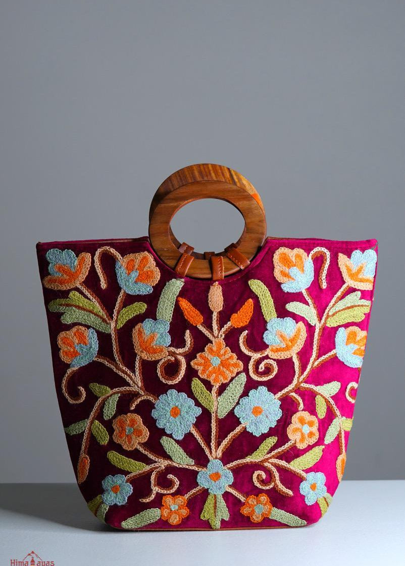 Beautiful hand embroidered tote bag with bright and multi-colour embroidered floral patterns.
