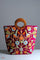 Beautiful hand embroidered tote bag with bright and multi-colour embroidered floral patterns.