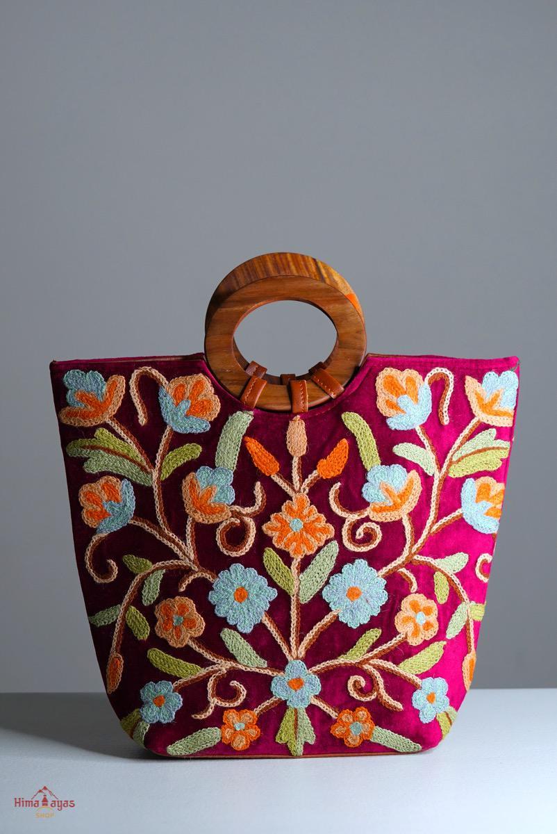 Beautiful hand embroidered tote bag with bright and multi-colour embroidered floral patterns.