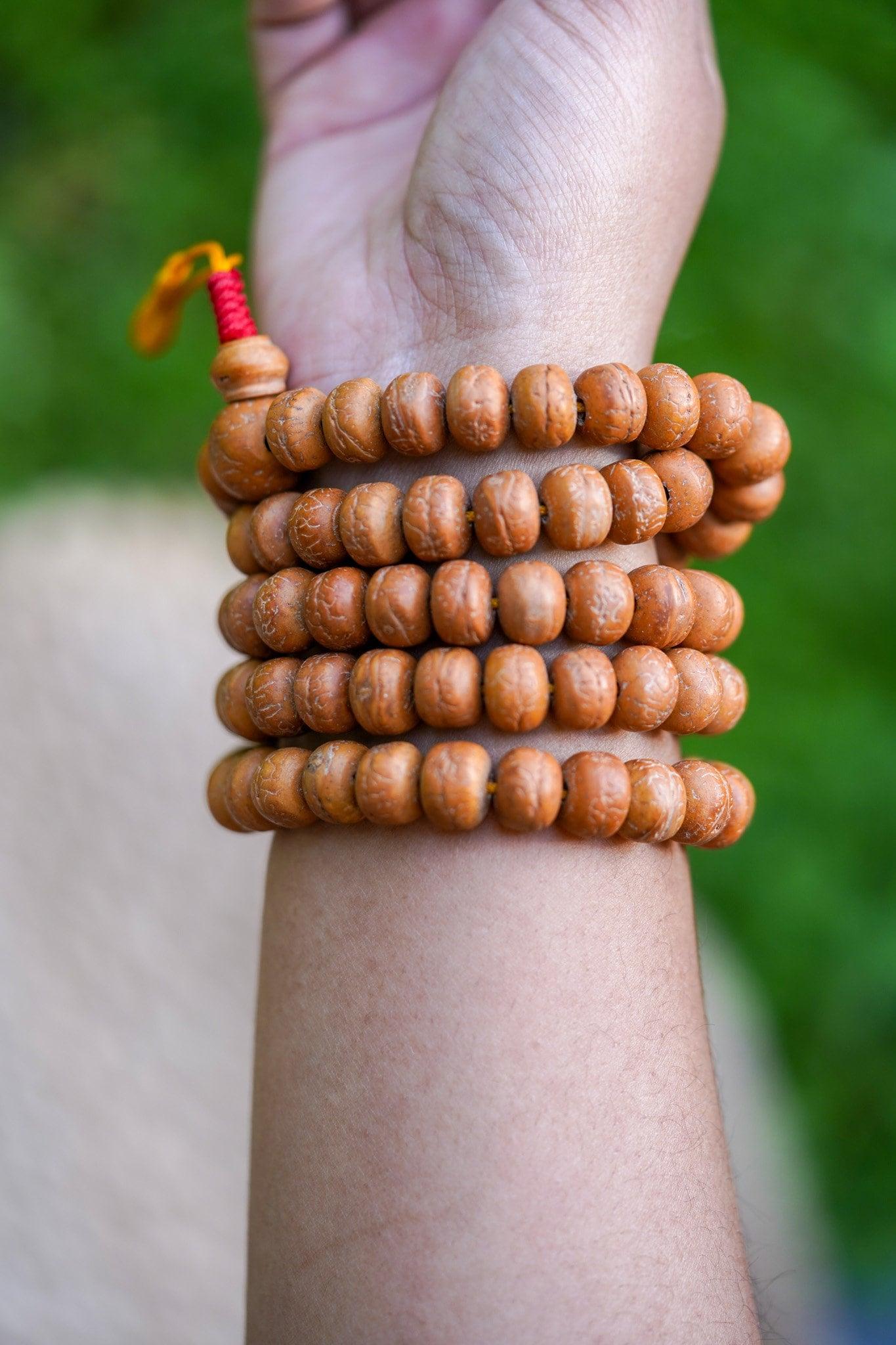Natural Bodhi Bead Wrist Mala being worn