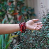Rosewood Mala being worn around wrist 
