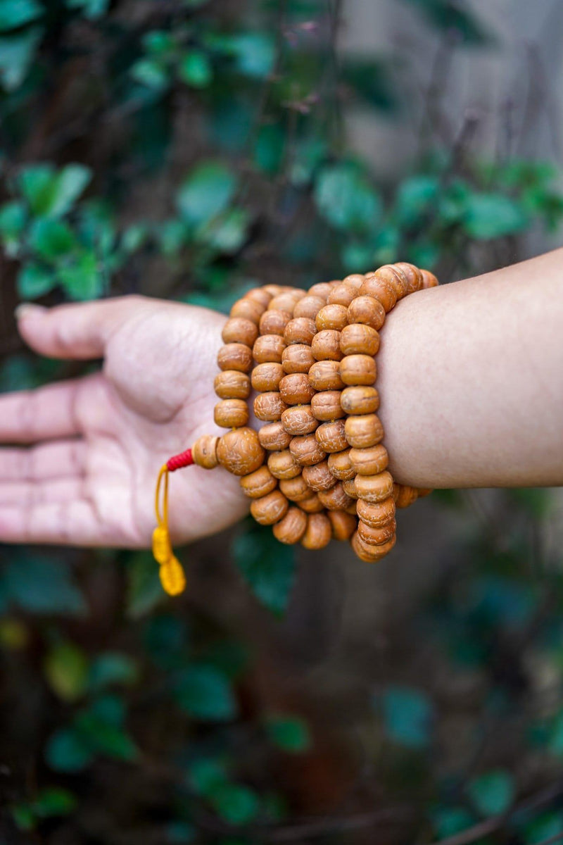 Natural Bodhi Bead Wrist Mala being worn 